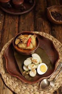 High angle view of eggs in basket on table