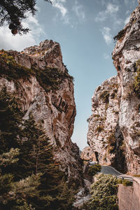 Low angle view of rock formation against sky