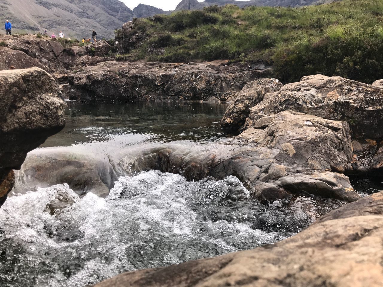 WATER FLOWING THROUGH ROCKS