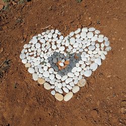 High angle view of heart shape on sand