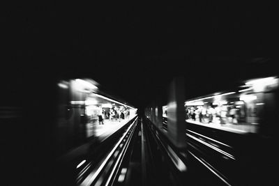 Blurred motion of train at railroad station at night