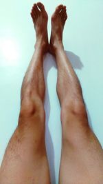 Low section of man legs against wall