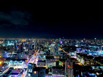 High angle view of illuminated buildings in city at night