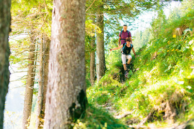Full length of woman walking in forest