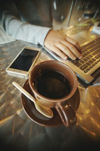 Close-up of coffee cup on table