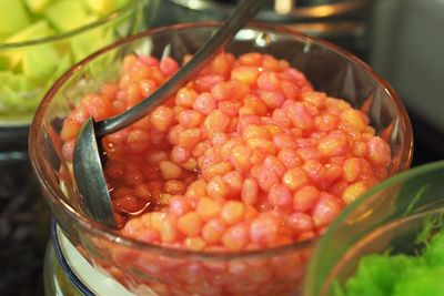 High angle view of strawberries in bowl on table