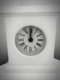 Low angle view of clock on wall