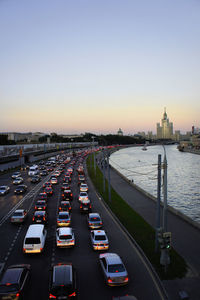 Traffic on road at sunset