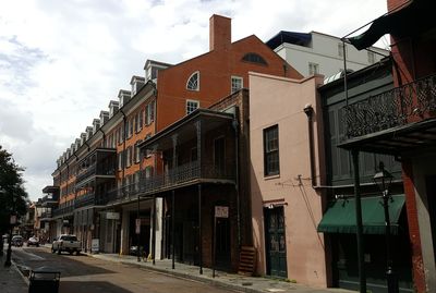 Street amidst buildings in city against sky