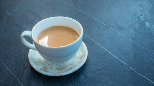 High angle view of coffee cup on table