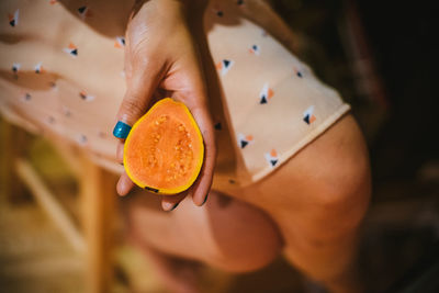 Close-up of cropped hand holding ice cream