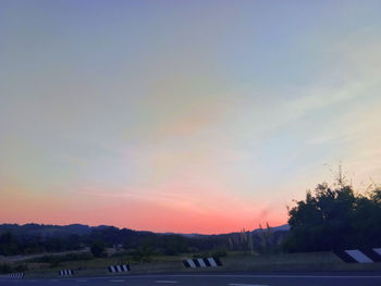 Silhouette landscape against sky during sunset