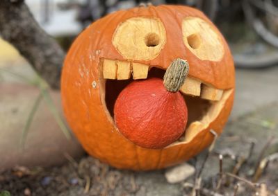 Close-up of jack o lantern on field, halloween, pumpkin