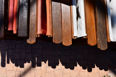 High angle view of clothes hanging on wood