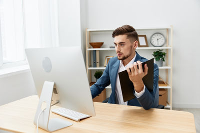 Businesswoman working at desk in office