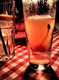 Close-up of beer glass on table