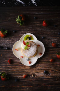 High angle view of fruits in plate on table