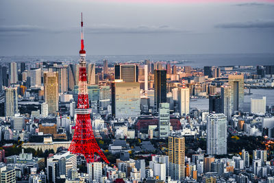 Illuminated cityscape against sky