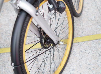 High angle view of bicycle wheel on road