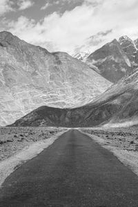 Scenic view of mountain road against sky