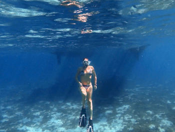 Man swimming in sea