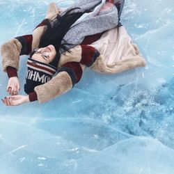 Woman lying on ice