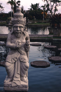 Statue by water