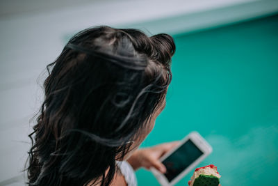 Portrait of woman using mobile phone