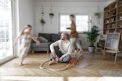 People sitting on sofa at home