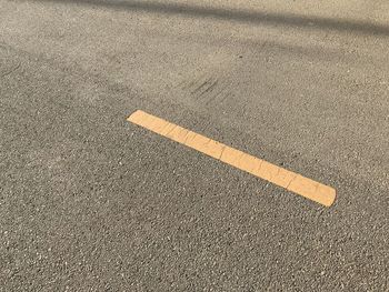High angle view of road sign on street