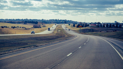 Aerial view of highway in city against sky