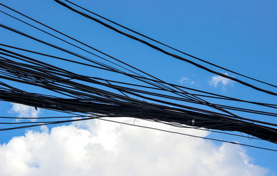 Low angle view of cables against sky