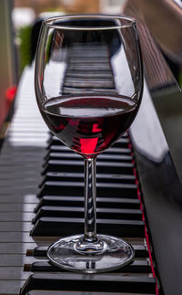 Close-up of wineglass on table