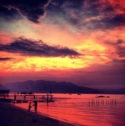 Scenic view of dramatic sky over sea during sunset