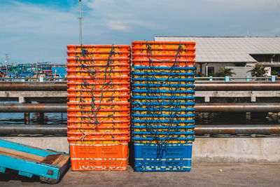 Stack of multi colored building against sky