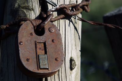 Close-up of padlock on fence
