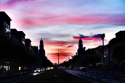 Cars moving on the road at sunset