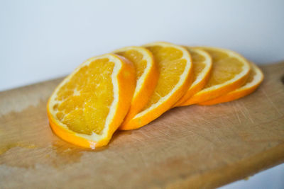 Close-up of orange slice on cutting board