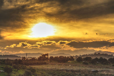 Scenic view of dramatic sky during sunset