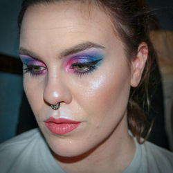 Close-up of thoughtful young woman with make-up