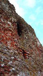 Low angle view of rock formation against sky