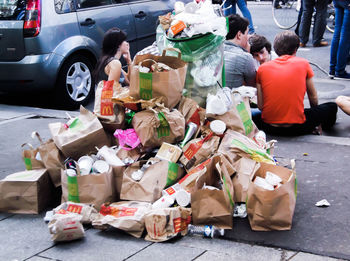 View of garbage on street in city