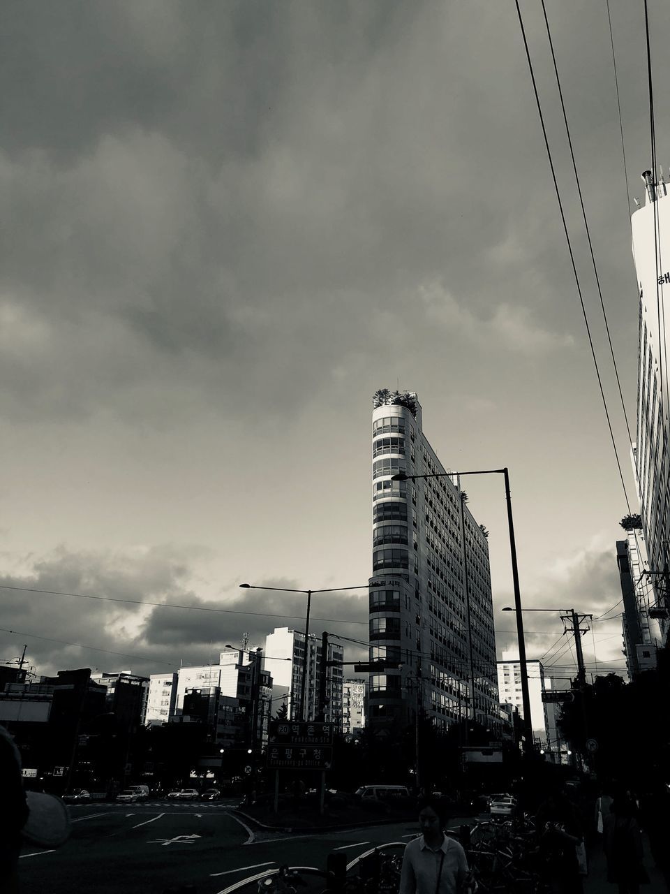 VIEW OF CITY STREET AND BUILDINGS AGAINST SKY