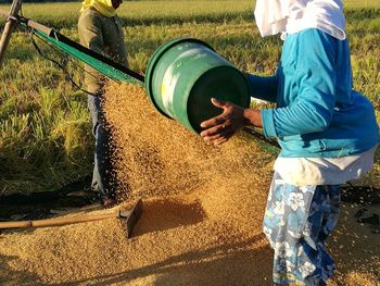 Low section of man working on field