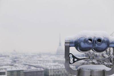 Close-up of cityscape against clear sky