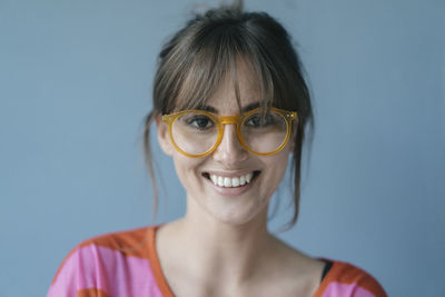 Young woman wearing glasses, portrait