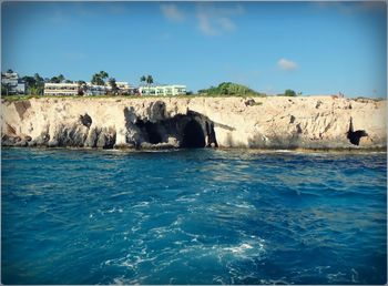 Scenic view of sea against blue sky