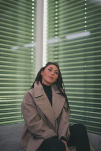 Portrait of young woman looking away