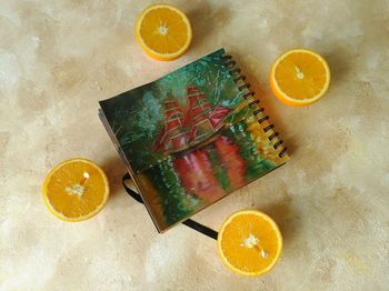 High angle view of orange fruits on table