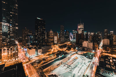 High angle view of illuminated buildings in city at night